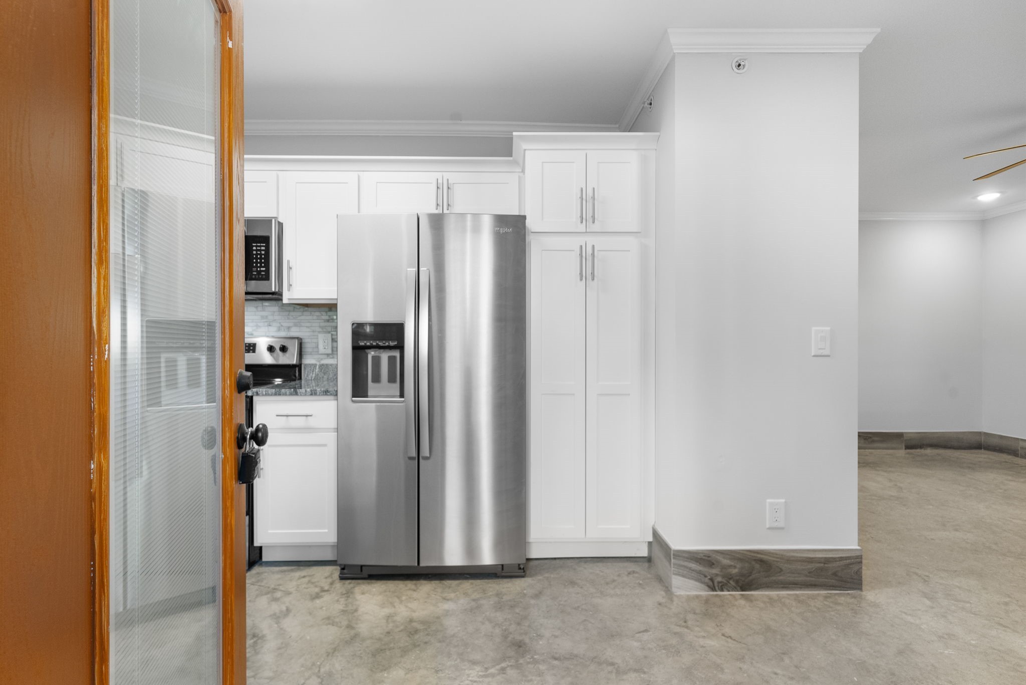 638 Madison Street, Unit 6 Clarksville, TN 37040 - Photo 5 of 25 a view of a kitchen with refrigerator and more cabinets