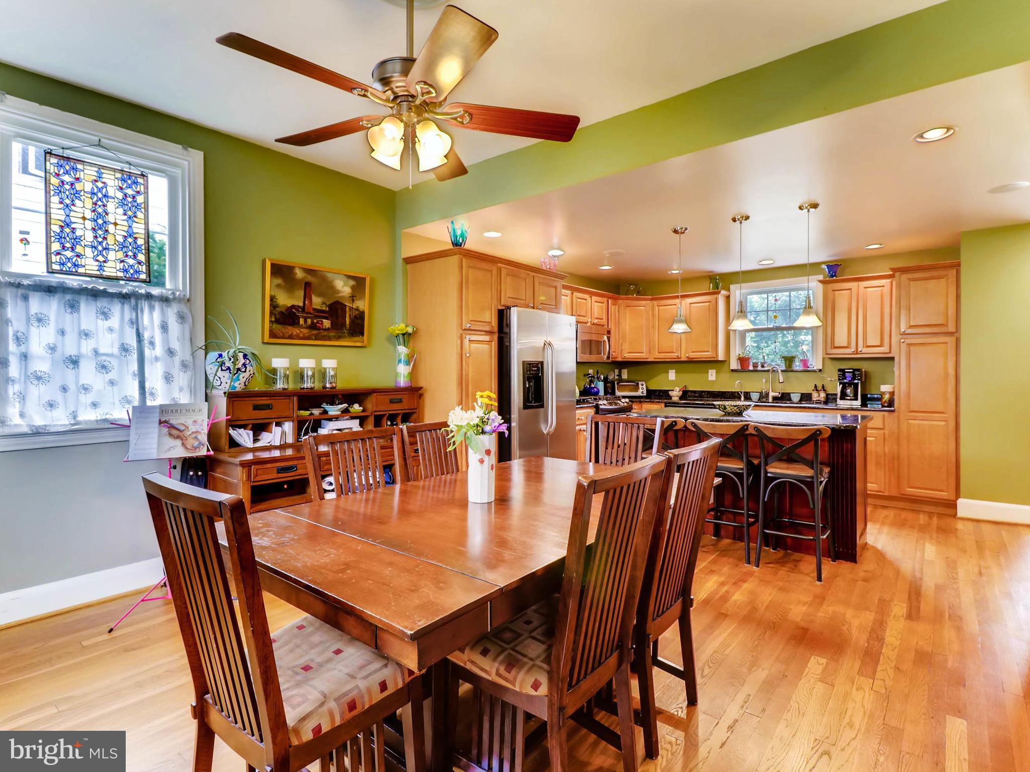 604 Coleraine Road Catonsville, MD 21229 - Photo 11 of 30 a dining room with stainless steel appliances lots of furniture and wooden floor