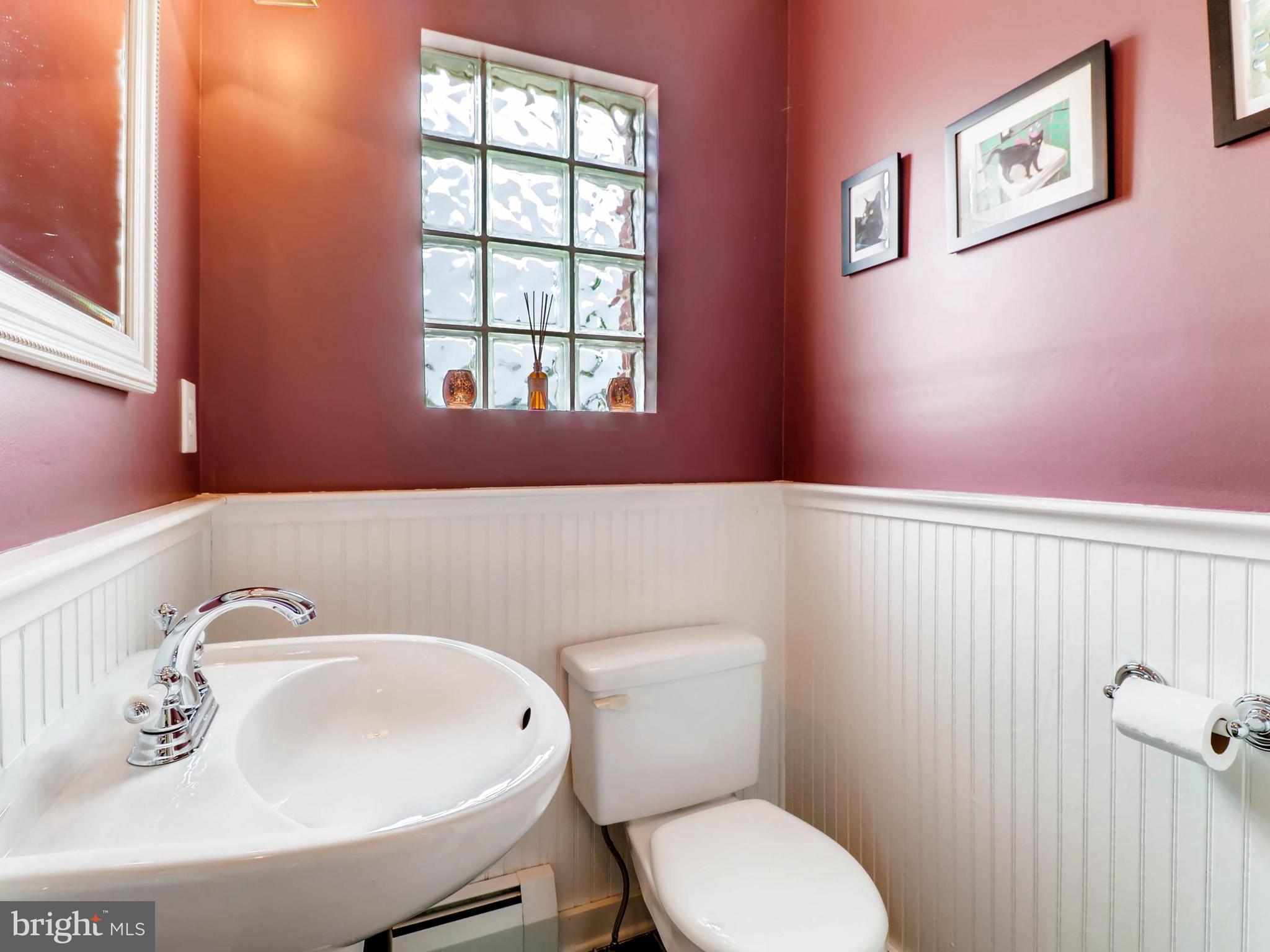 604 Coleraine Road Catonsville, MD 21229 - Photo 12 of 30 a bathroom with a sink a toilet and a window