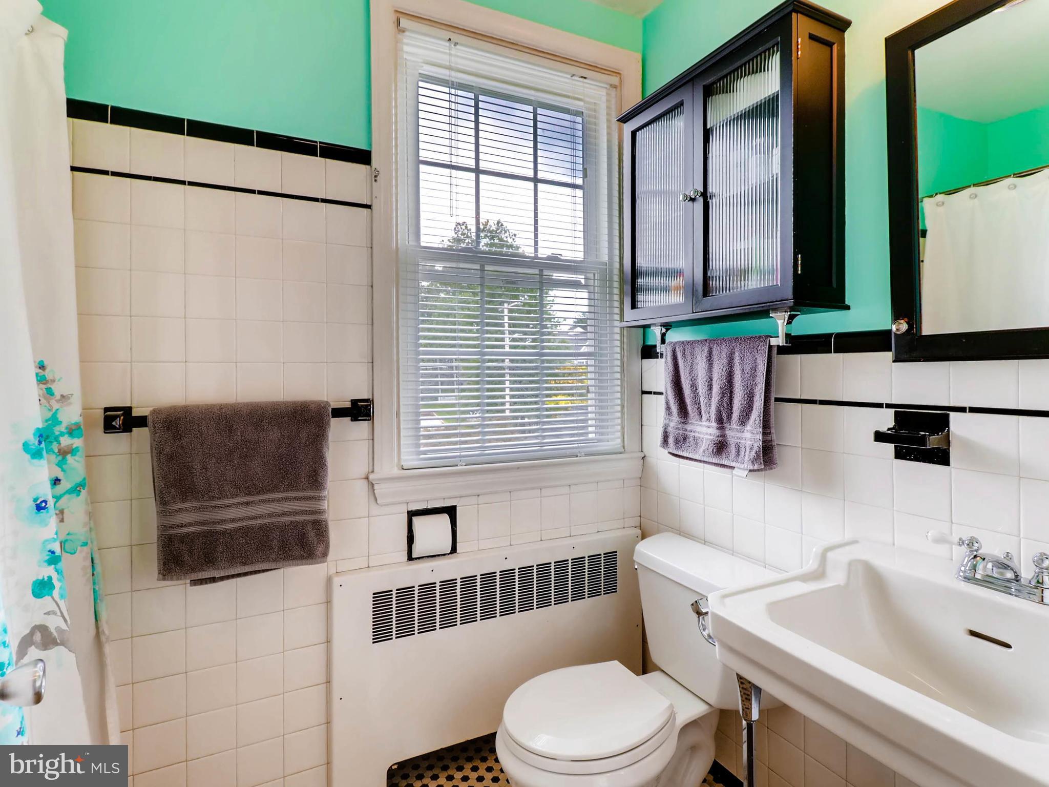 604 Coleraine Road Catonsville, MD 21229 - Photo 15 of 30 a bathroom with a sink a toilet and shower