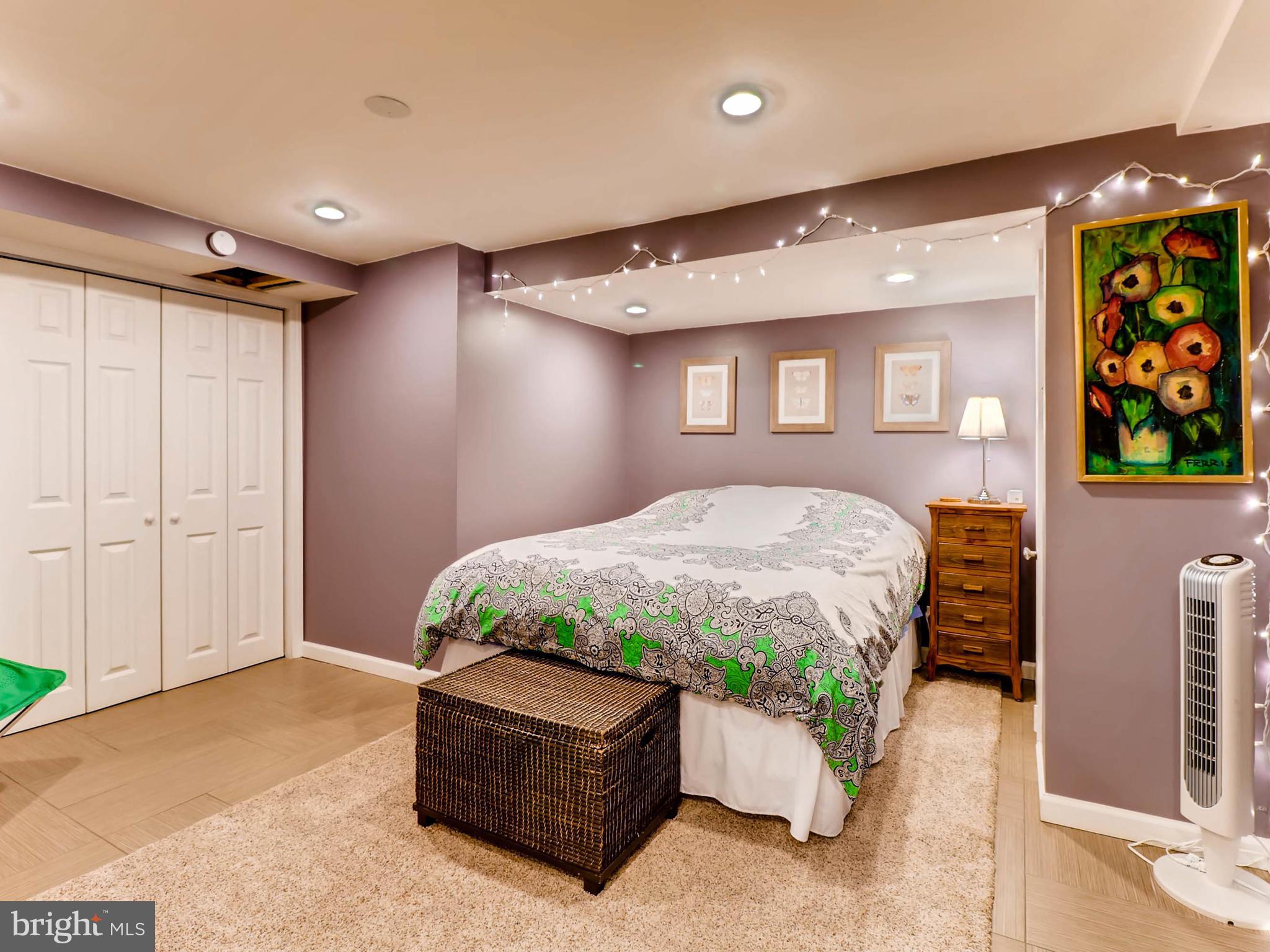 604 Coleraine Road Catonsville, MD 21229 - Photo 20 of 30 a spacious bedroom with a bed and a painting on the wall