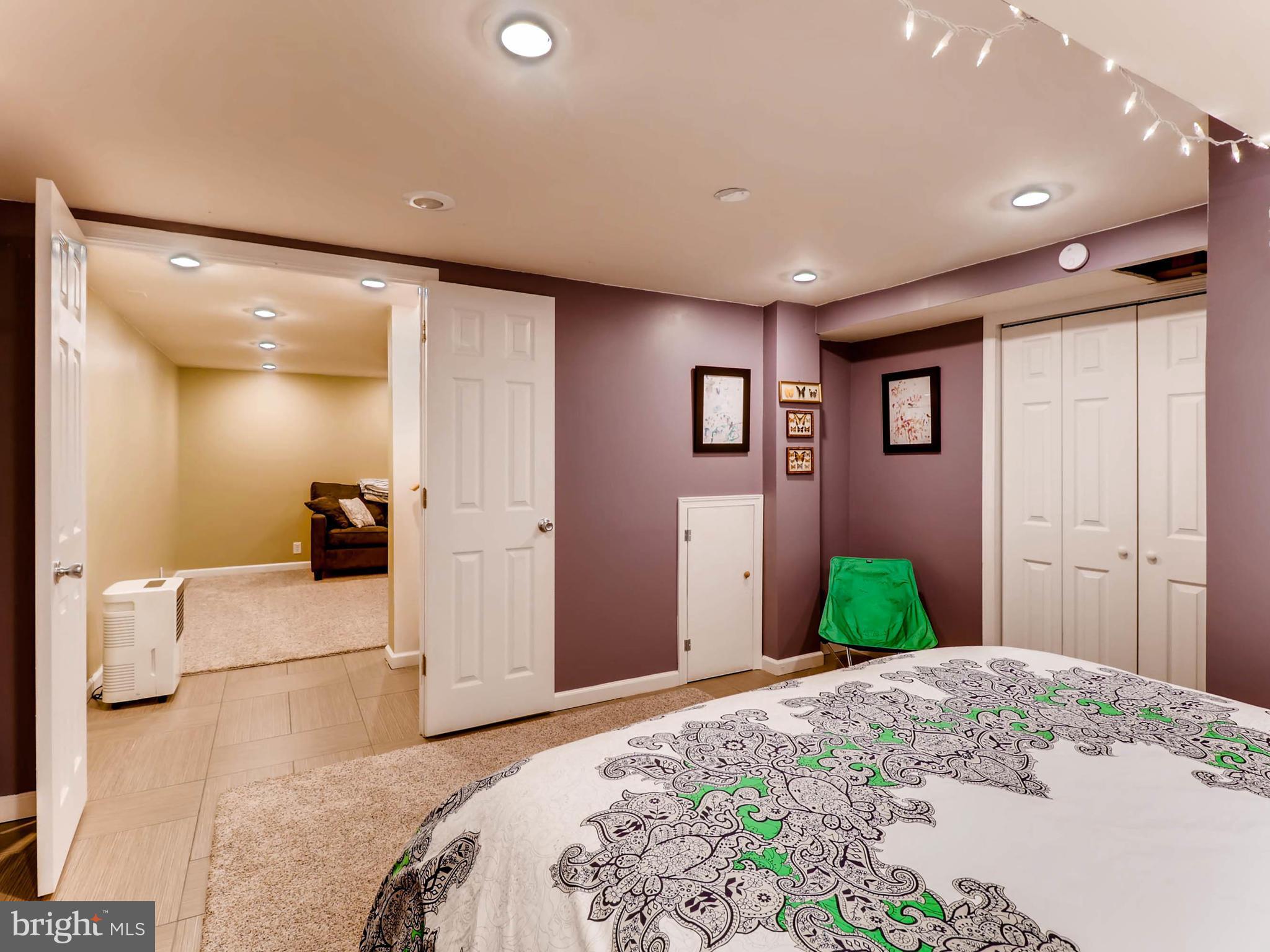 604 Coleraine Road Catonsville, MD 21229 - Photo 21 of 30 a bedroom with a bed and a large mirror