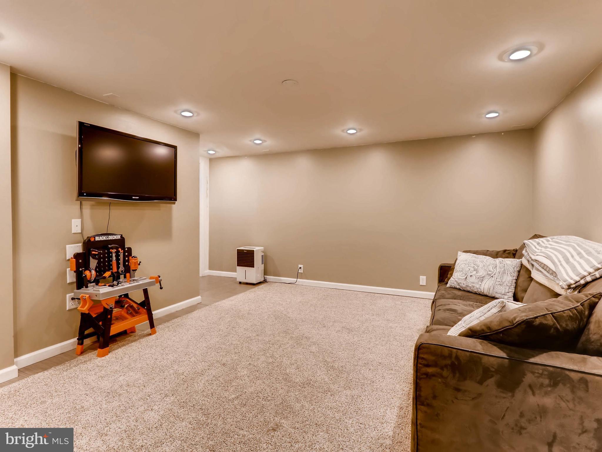 604 Coleraine Road Catonsville, MD 21229 - Photo 23 of 30 a living room with furniture and a flat screen tv
