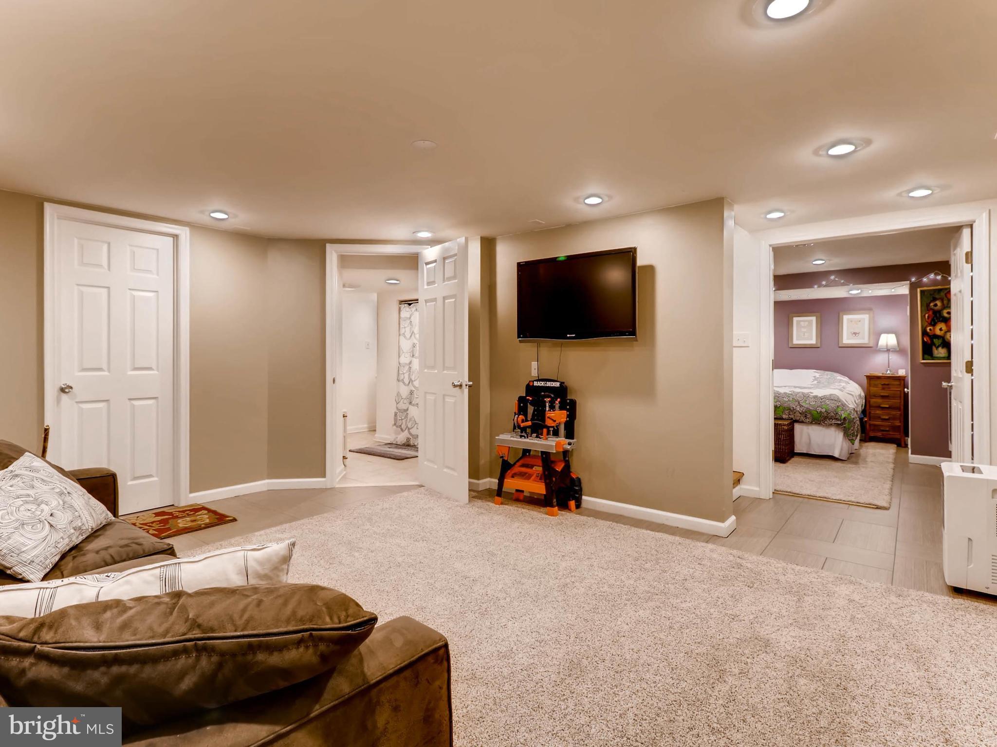 604 Coleraine Road Catonsville, MD 21229 - Photo 24 of 30 a bedroom with furniture and a flat screen tv