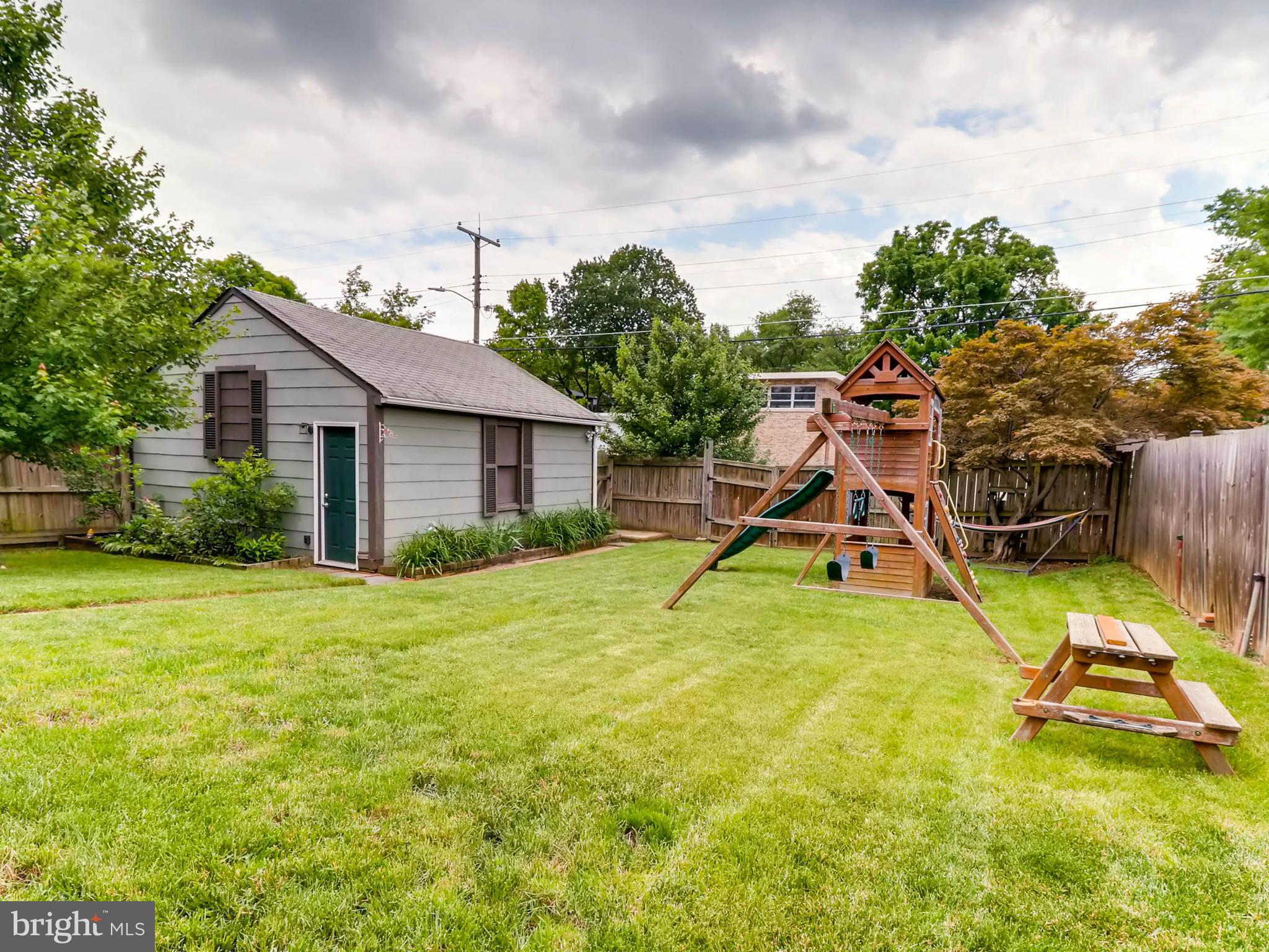 604 Coleraine Road Catonsville, MD 21229 - Photo 29 of 30 a view of a house with a swimming pool and a yard