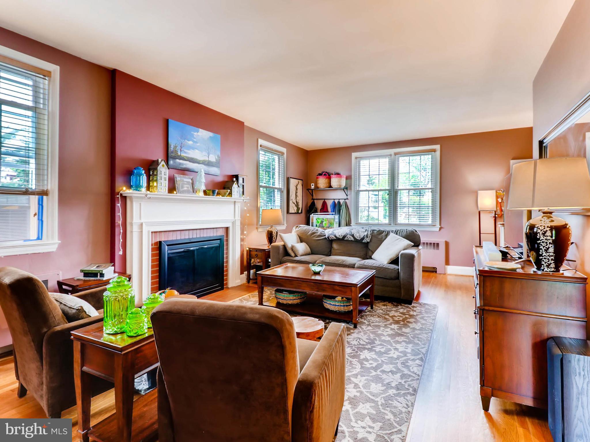 604 Coleraine Road Catonsville, MD 21229 - Photo 4 of 30 a living room with furniture a fireplace and a large window