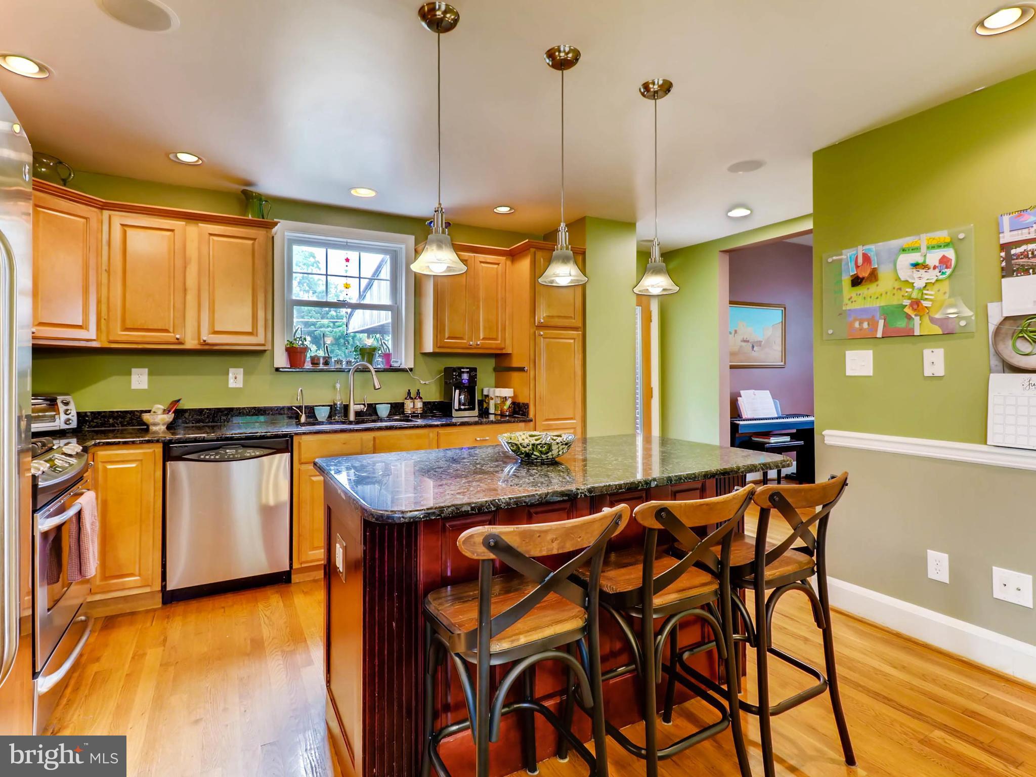 604 Coleraine Road Catonsville, MD 21229 - Photo 8 of 30 a kitchen with stainless steel appliances granite countertop a stove a sink and a refrigerator