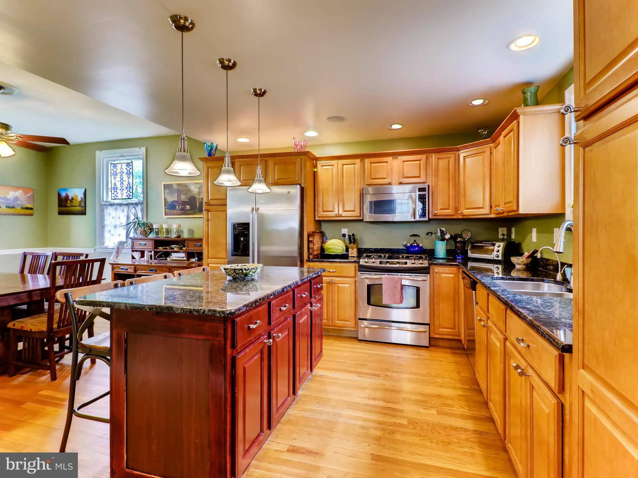 604 Coleraine Road Catonsville, MD 21229 - Photo 10 of 30 a kitchen with stainless steel appliances granite countertop a stove and a sink