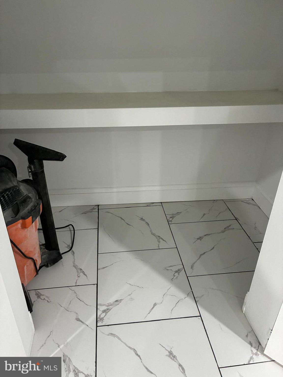 1700 Federal Street Baltimore, MD 21213 - Photo 32 of 41 Spacious closet with sleek tile flooring.