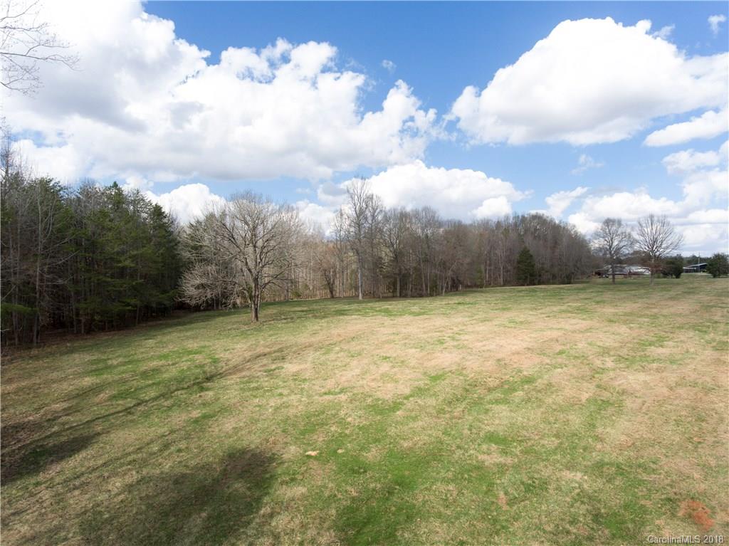 3 Lincoln Road York, SC 29745 - Photo 6 of 9 a view of a swimming pool with a yard and wooden fence