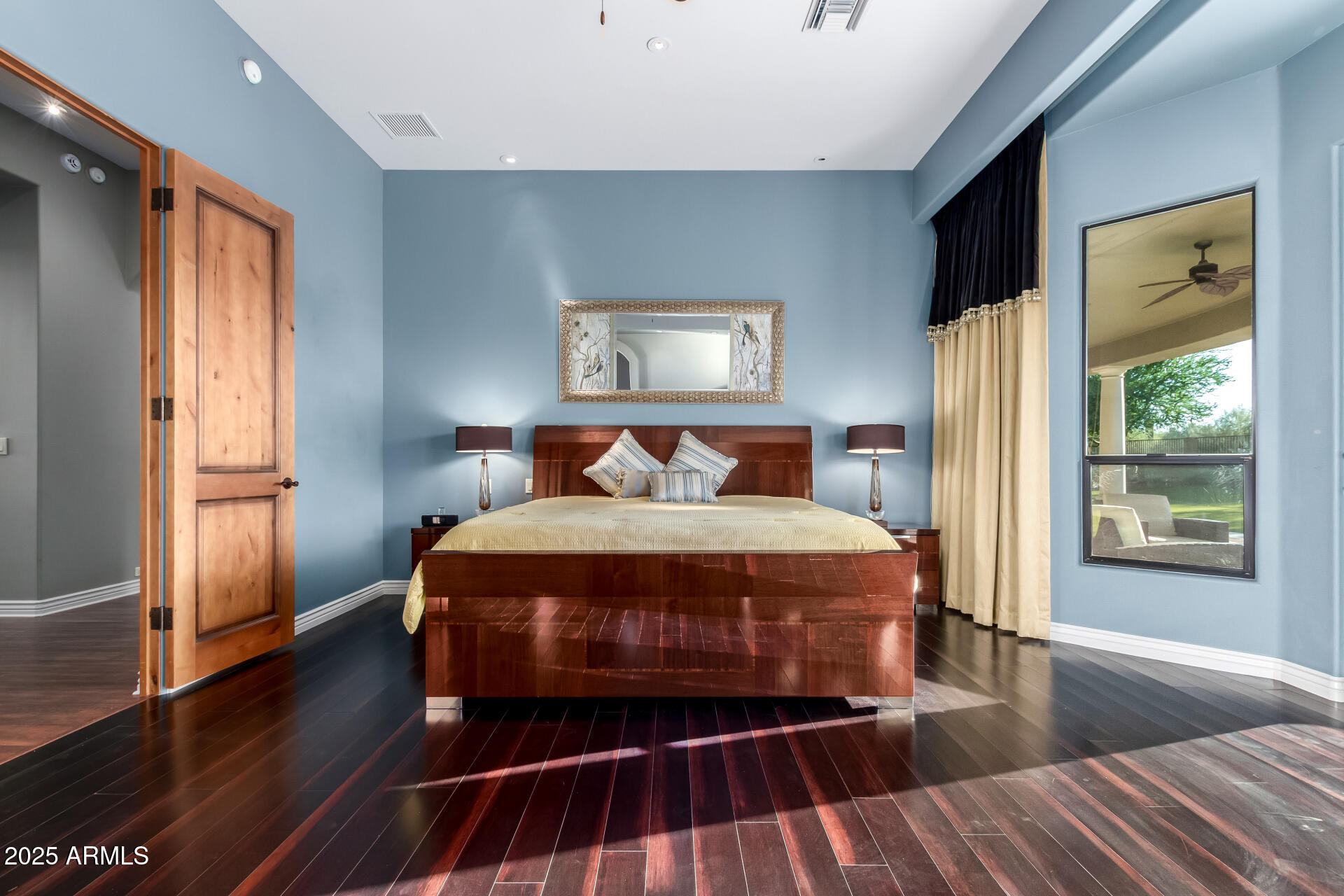 27314 North Azatlan Drive Rio Verde, AZ 85263 - Photo 23 of 62 a bedroom with a bed and wooden floor