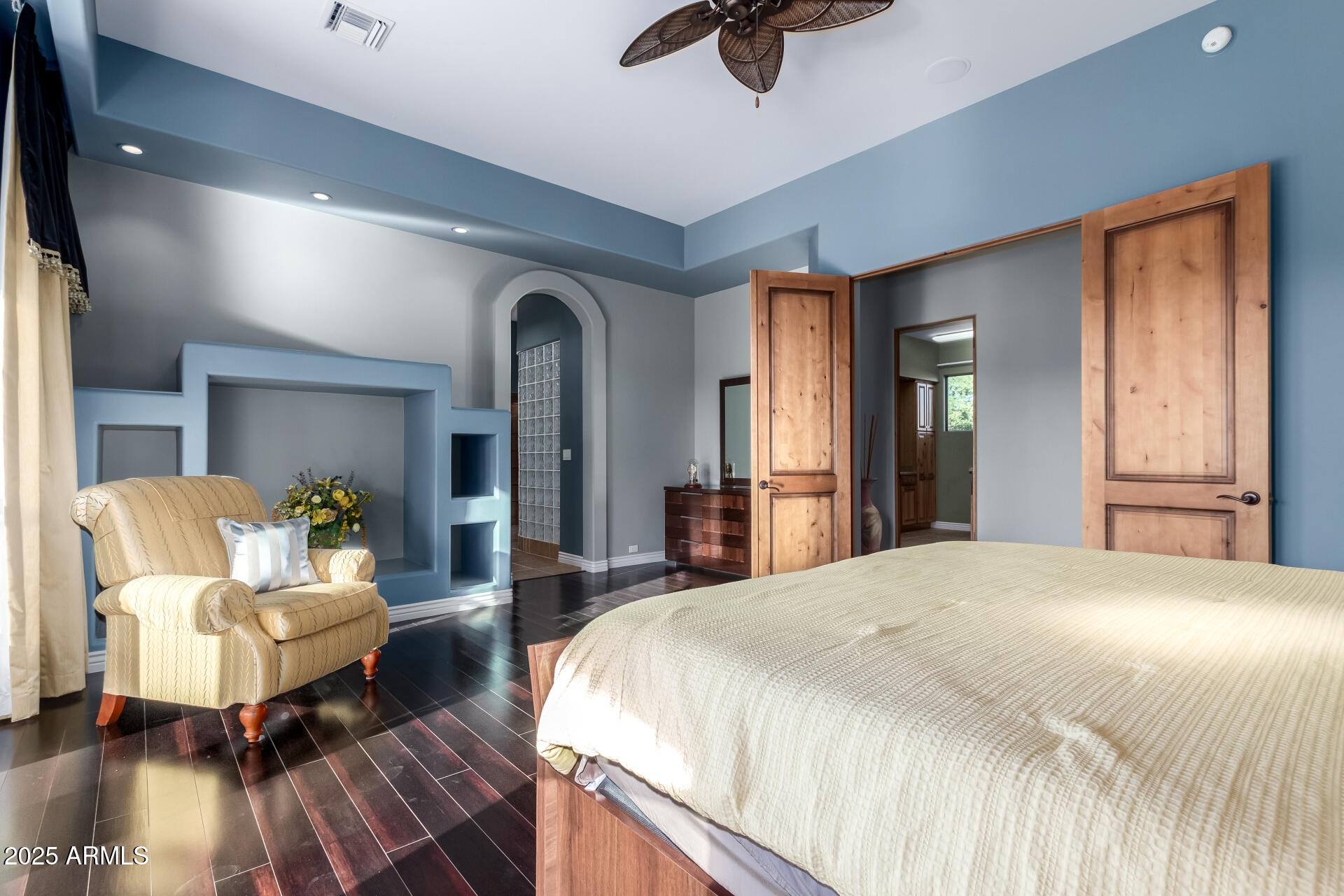 27314 North Azatlan Drive Rio Verde, AZ 85263 - Photo 25 of 62 a spacious bedroom with a bed and wooden floor