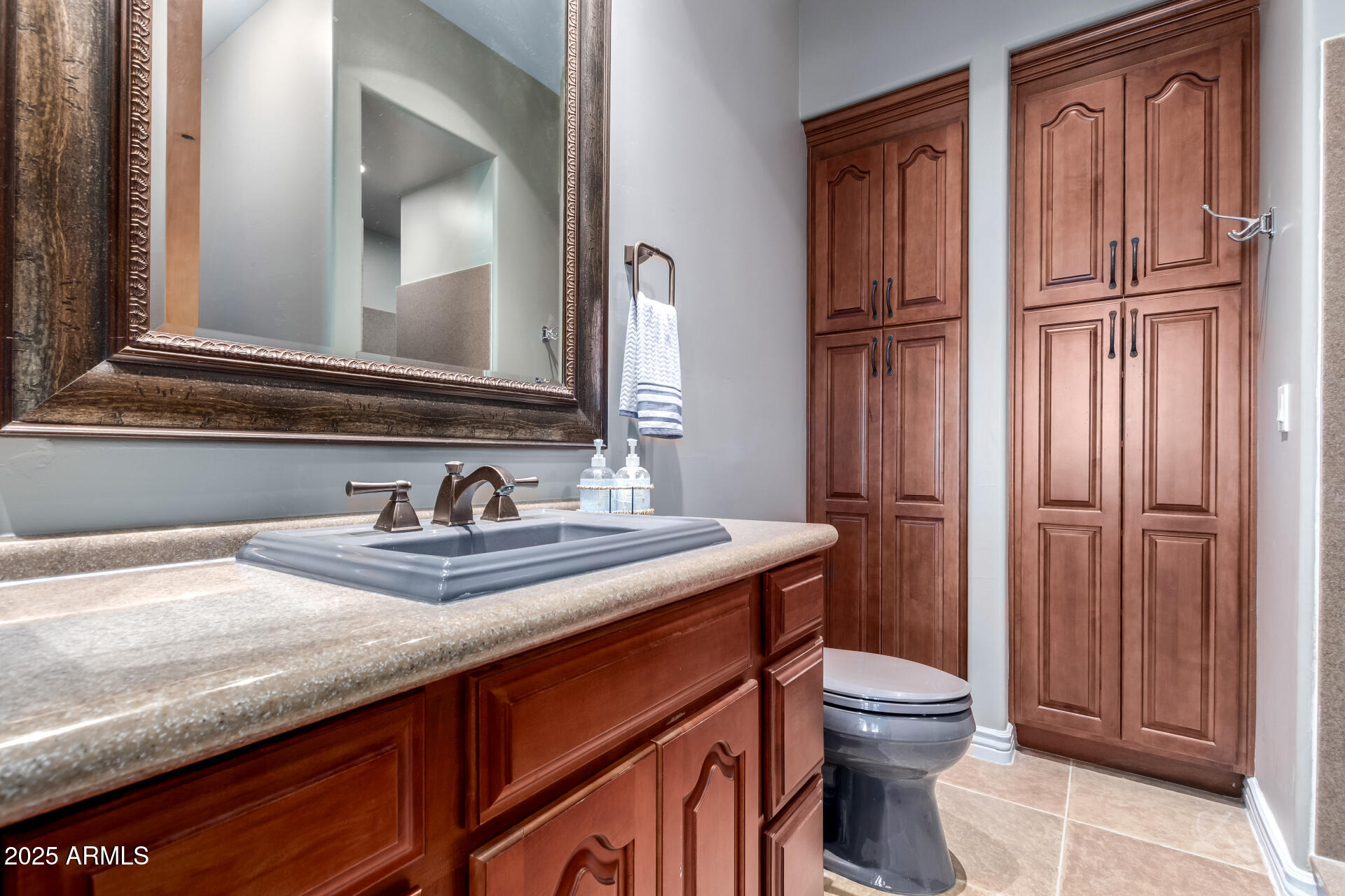 27314 North Azatlan Drive Rio Verde, AZ 85263 - Photo 30 of 62 a bathroom with a granite countertop sink toilet and mirror