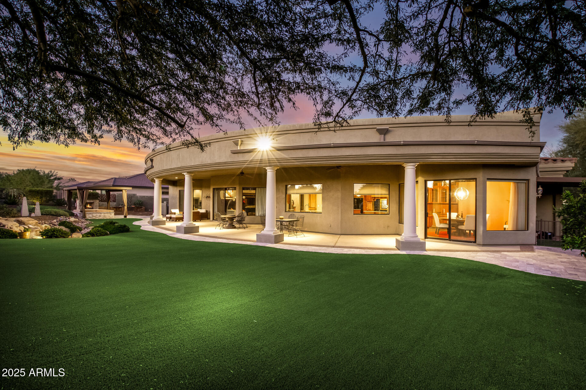 27314 North Azatlan Drive Rio Verde, AZ 85263 - Photo 38 of 62 a front view of a house with a garden