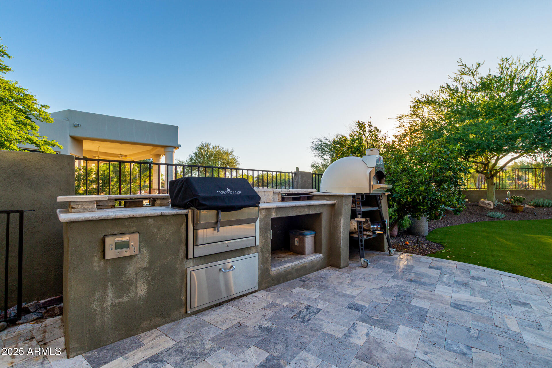 27314 North Azatlan Drive Rio Verde, AZ 85263 - Photo 50 of 62 a kitchen with stainless steel appliances a stove and a fireplace