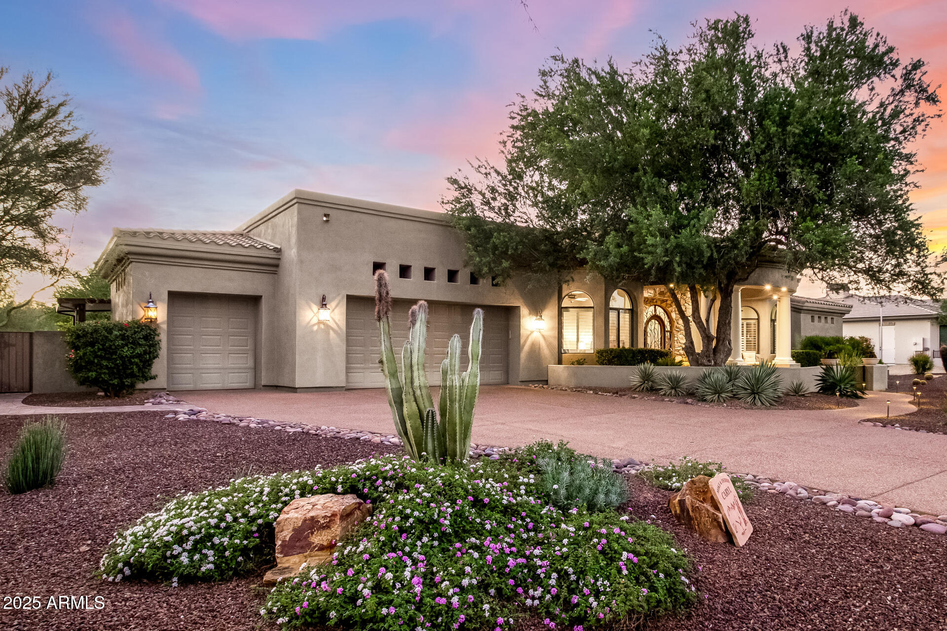 27314 North Azatlan Drive Rio Verde, AZ 85263 - Photo 5 of 62 a front view of a house with a yard and outdoor seating