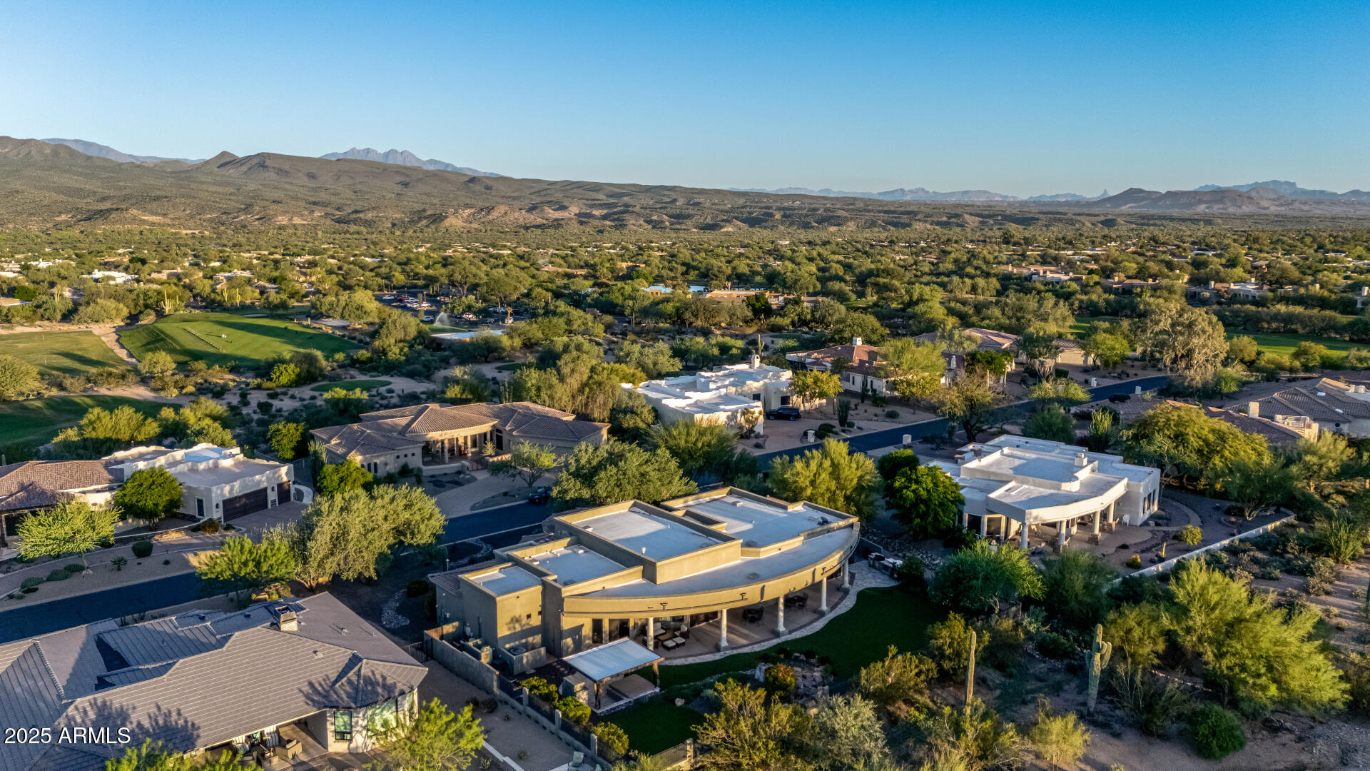 27314 North Azatlan Drive Rio Verde, AZ 85263 - Photo 56 of 62 an aerial view of a city with lots of residential buildings and mountain view in back