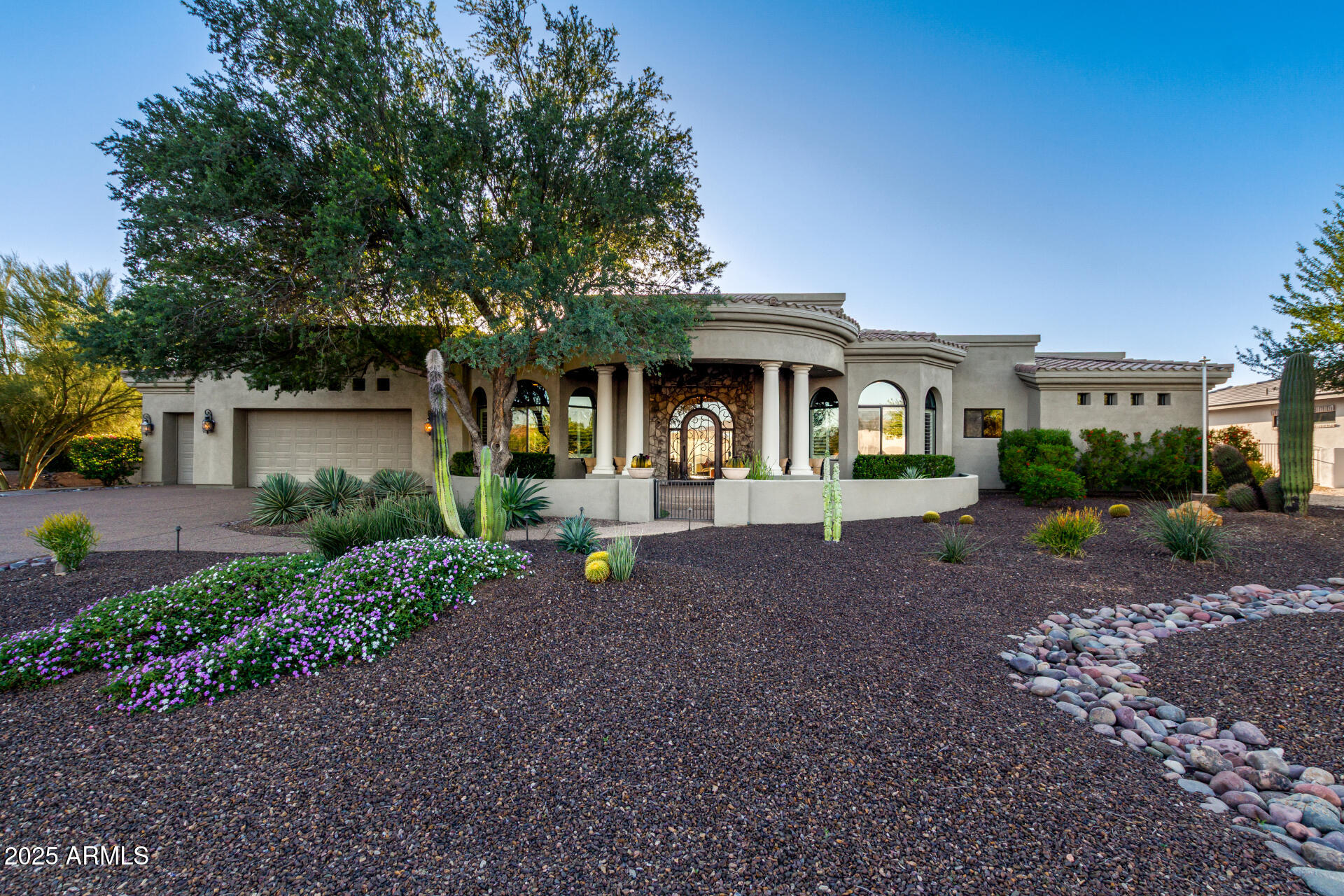 27314 North Azatlan Drive Rio Verde, AZ 85263 - Photo 7 of 62 a front view of a house with garden