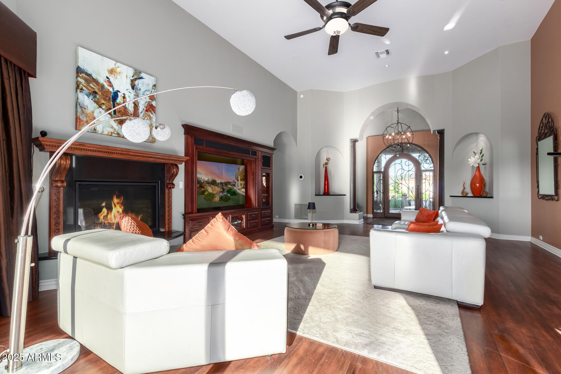 27314 North Azatlan Drive Rio Verde, AZ 85263 - Photo 8 of 62 a living room with fireplace furniture and a large window