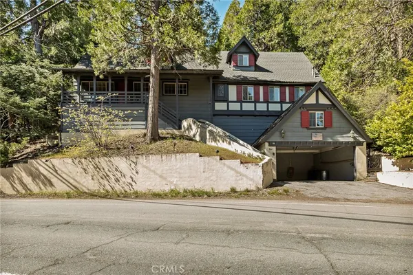a front view of a house with garage