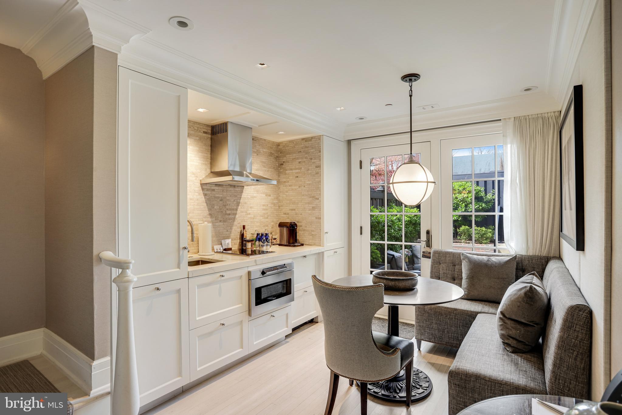1040 31st Street Northwest Washington, DC 20007 - Photo 11 of 35 a view of a dining room with furniture window and outside view