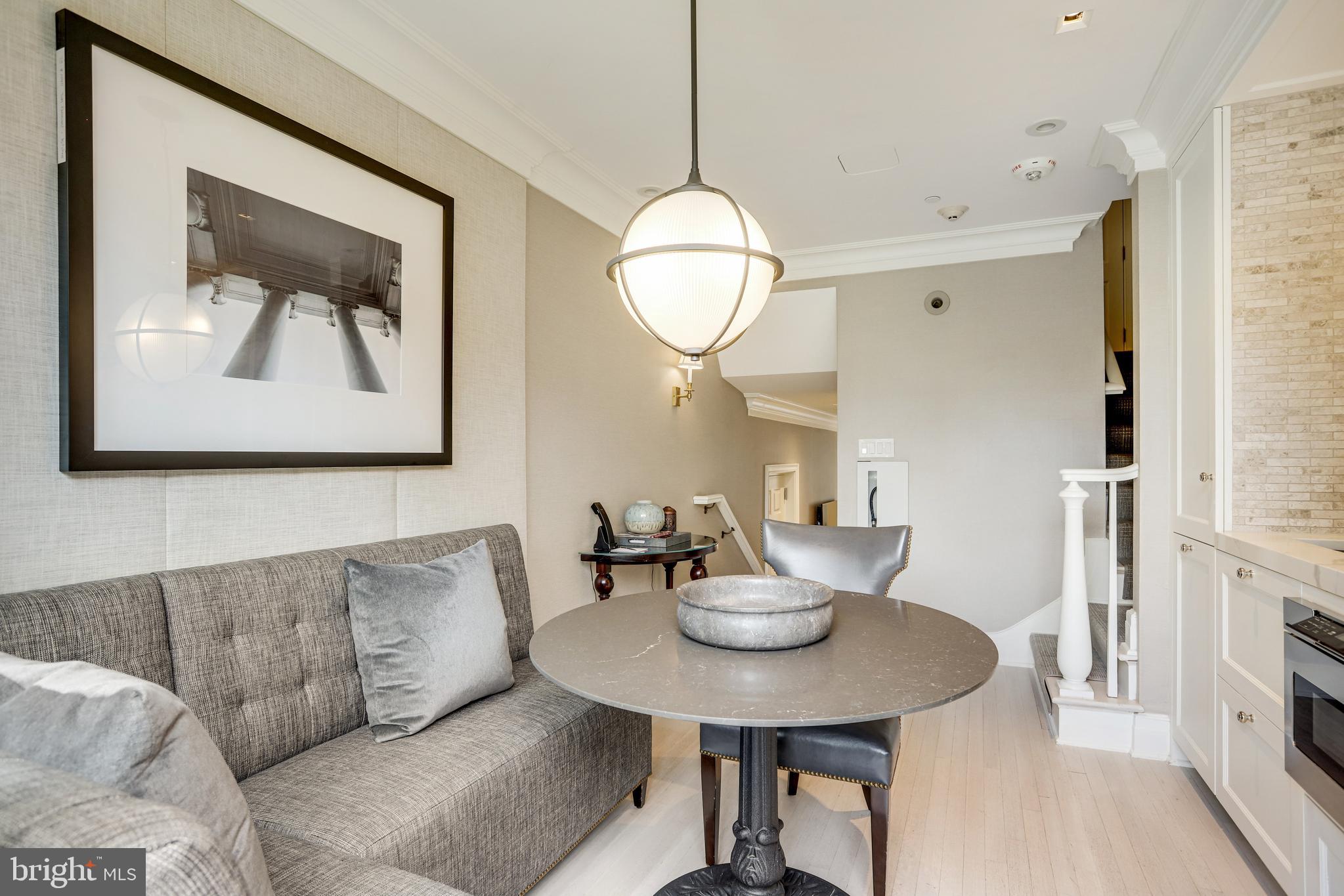 1040 31st Street Northwest Washington, DC 20007 - Photo 13 of 35 a view of a dining room with furniture and wooden floor