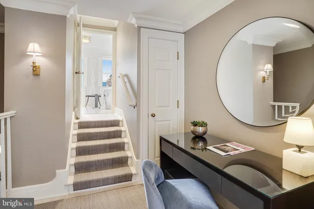 a view of a livingroom with furniture and a mirror