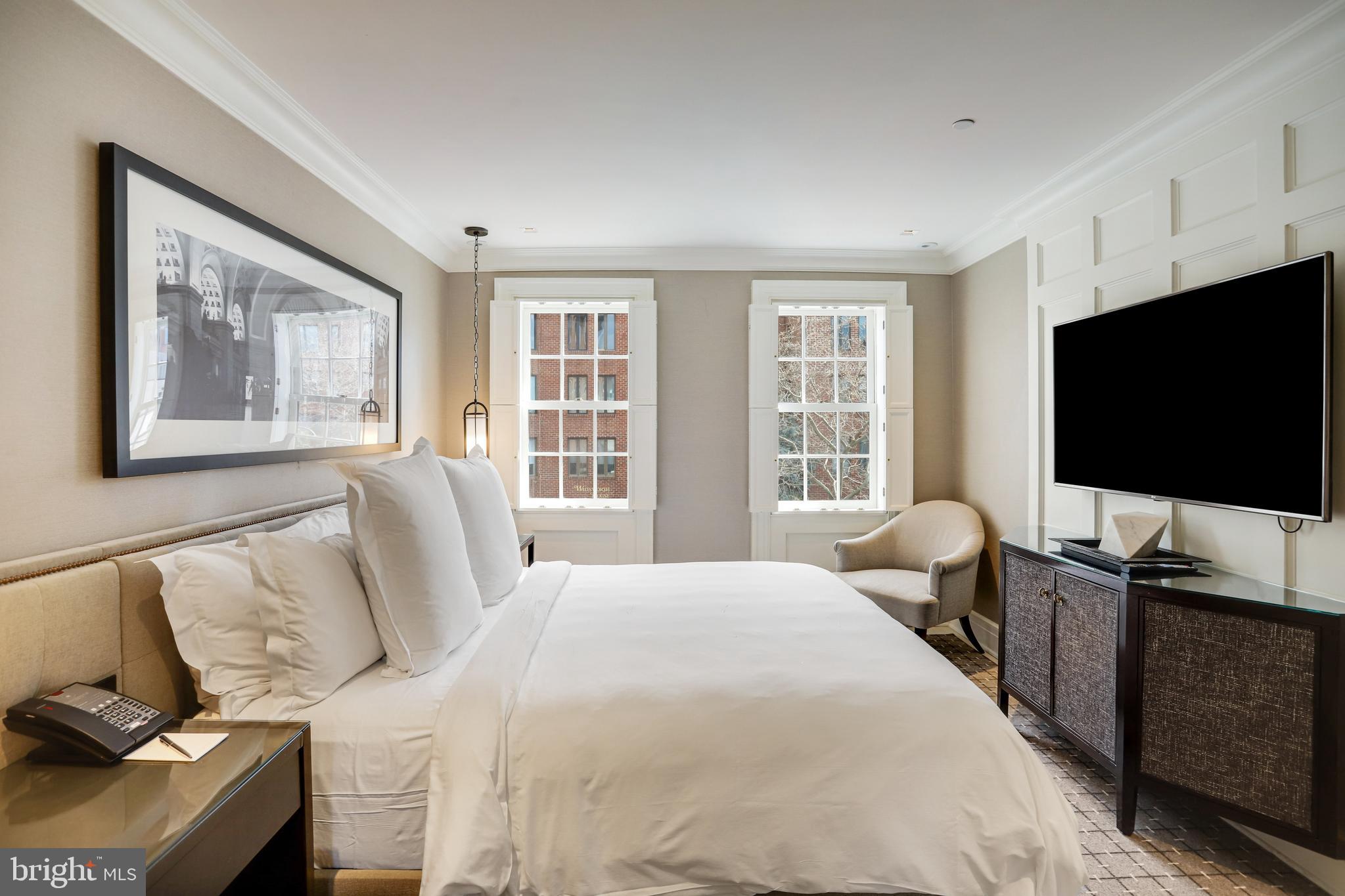 1040 31st Street Northwest Washington, DC 20007 - Photo 17 of 35 a bedroom with a bed and a flat screen tv