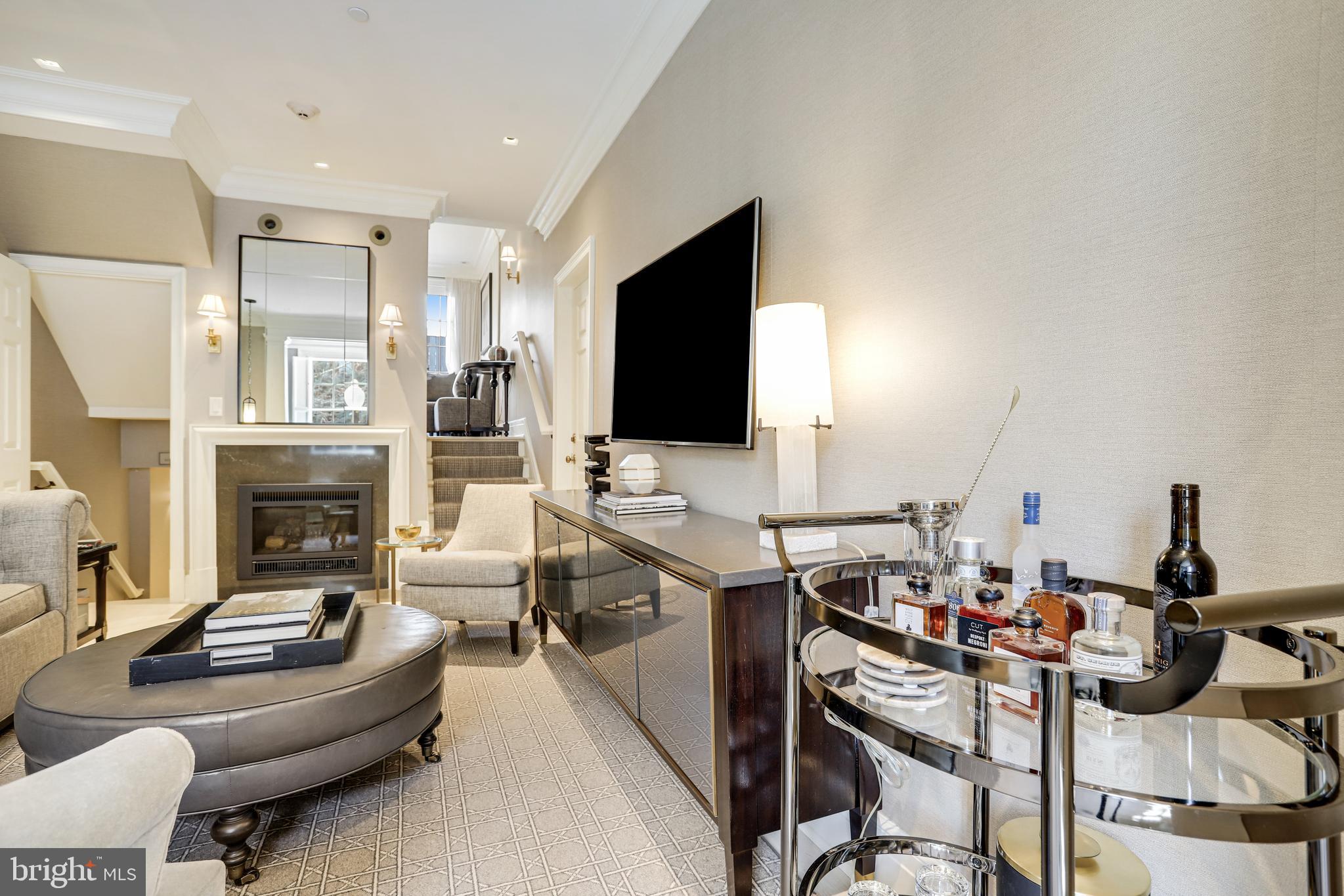 1040 31st Street Northwest Washington, DC 20007 - Photo 4 of 35 a living room with furniture and a flat screen tv