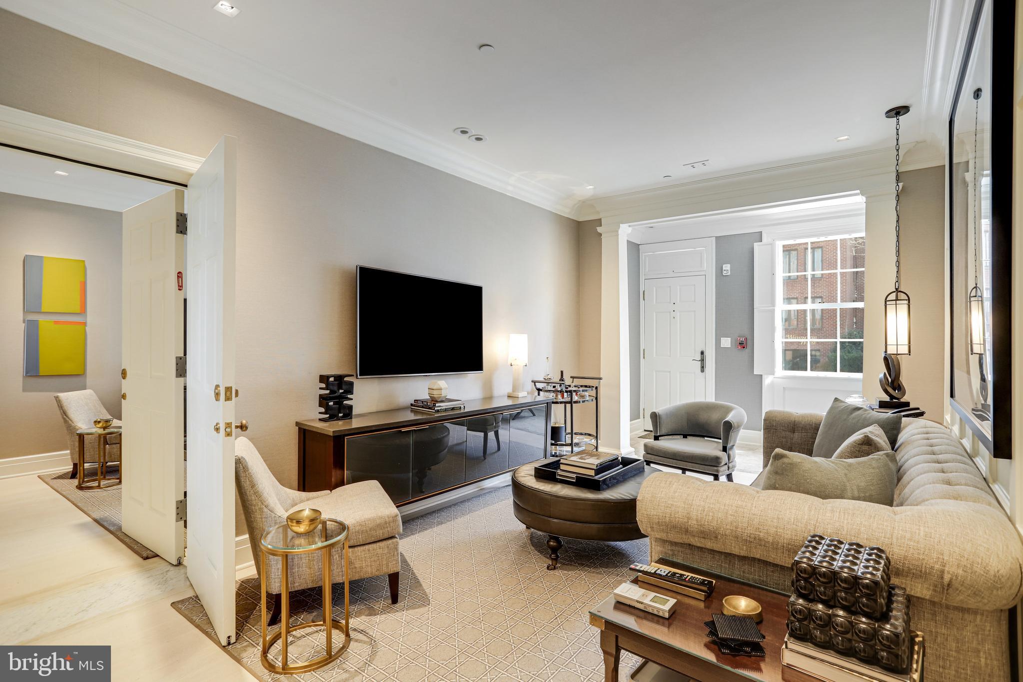 1040 31st Street Northwest Washington, DC 20007 - Photo 7 of 35 a living room with furniture and a flat screen tv