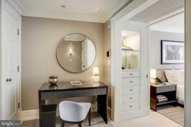 a bathroom with a toilet a sink and a mirror