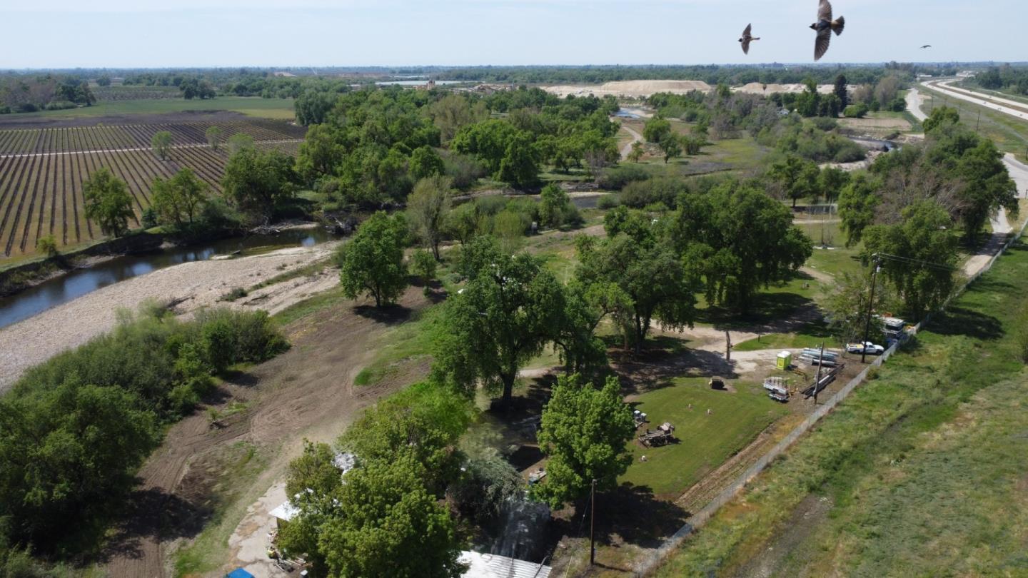 17439 East Kings Canyon Road Sanger, CA 93657 - Photo 2 of 3 an aerial view of a house with a yard