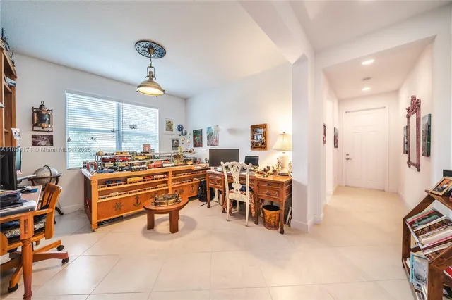 a room with lots of chairs and mirrors