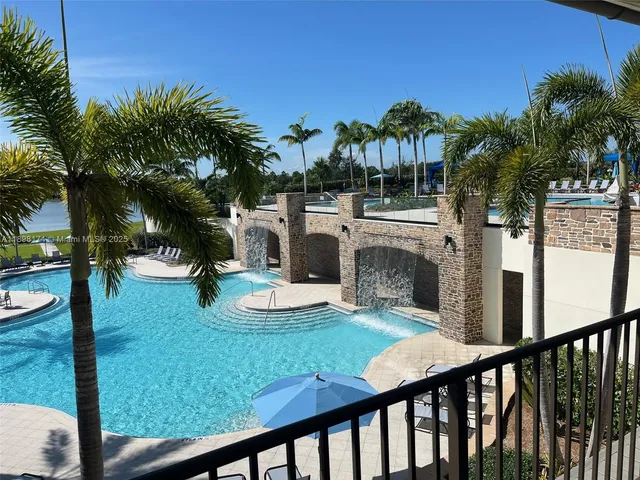 a view of swimming pool from a balcony