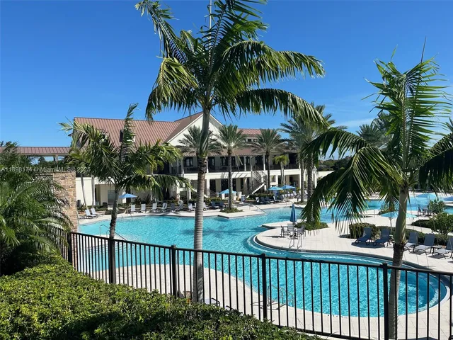 a view of a backyard and palm tree