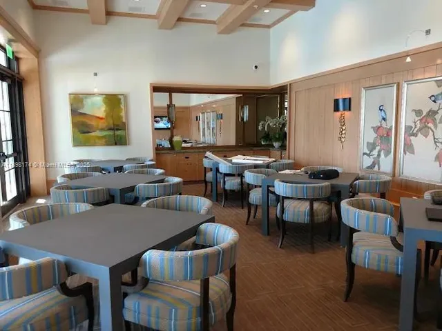 a living room with furniture a rug and a window