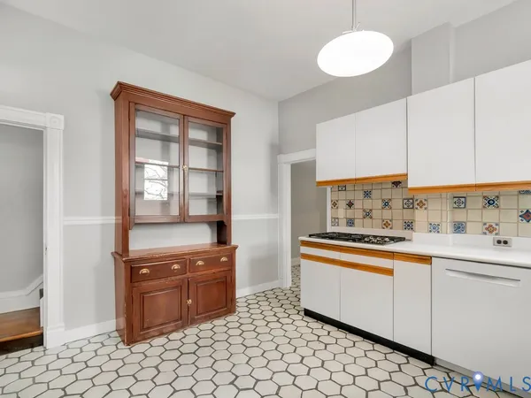 a kitchen with a stove and a sink