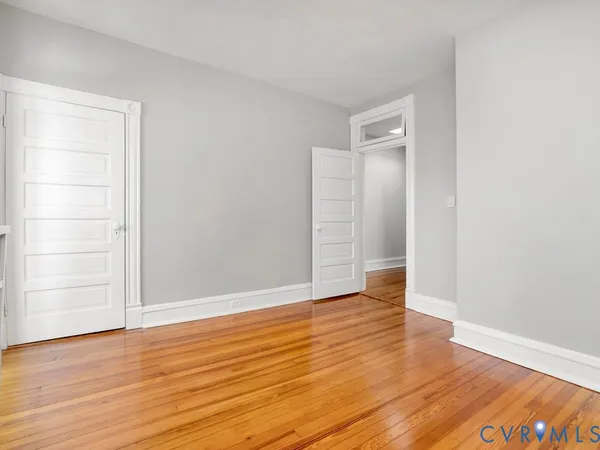 an empty room with wooden floor