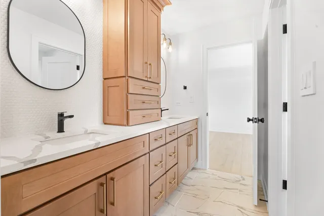a bathroom with a sink and a mirror