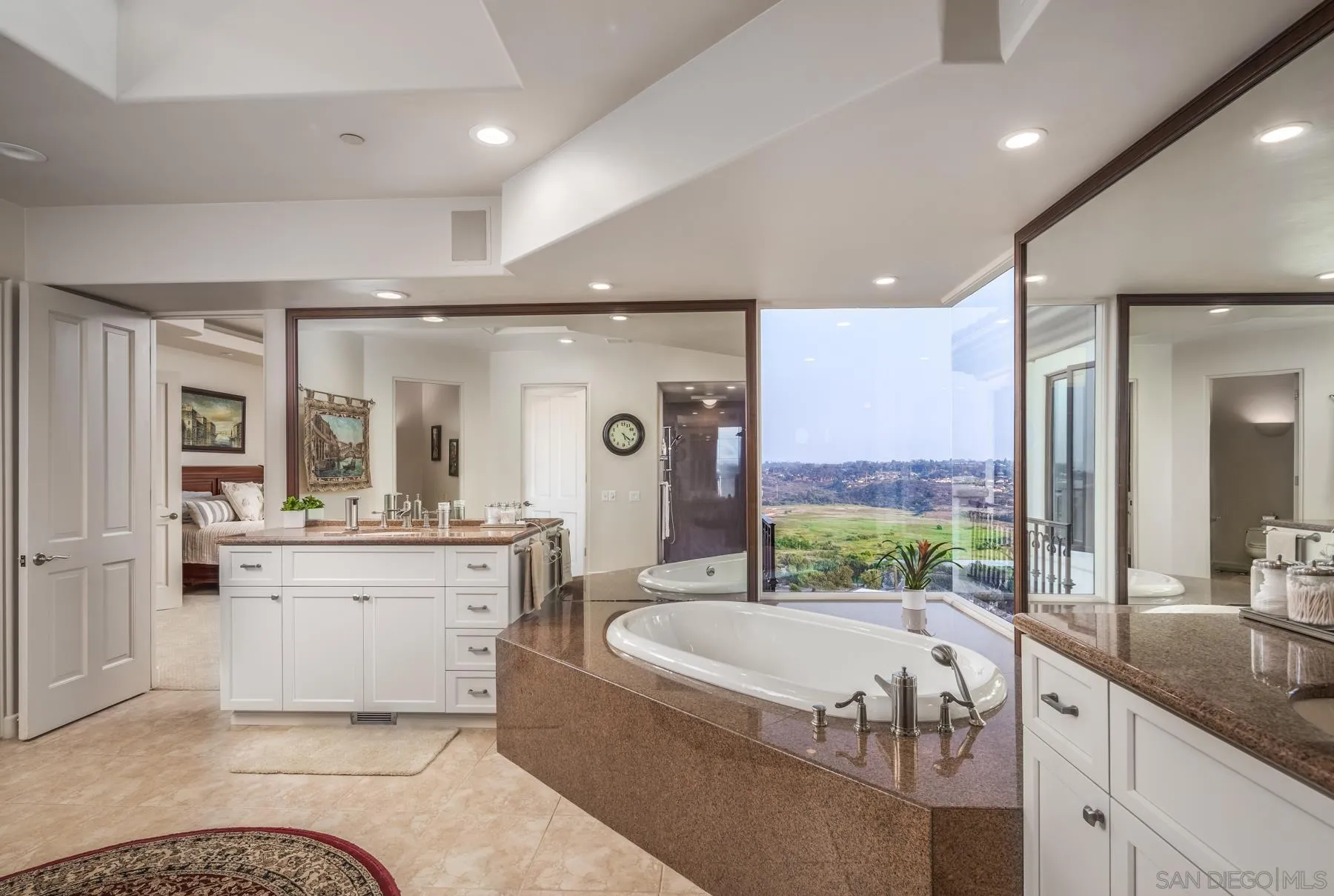 1375 Este Vista Court Encinitas, CA 92024 - Photo 15 of 31 a bathroom with a granite countertop tub sink and mirror