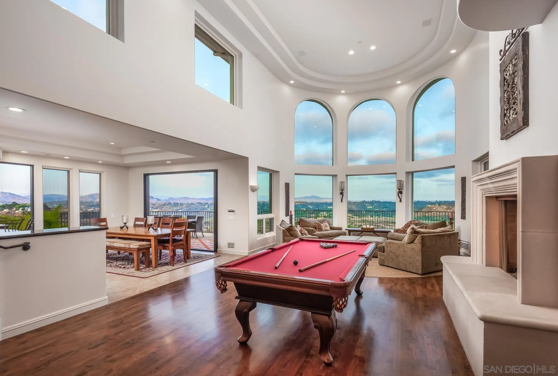 1375 Este Vista Court Encinitas, CA 92024 - Photo 4 of 31 a living room with furniture a rug kitchen view and large windows