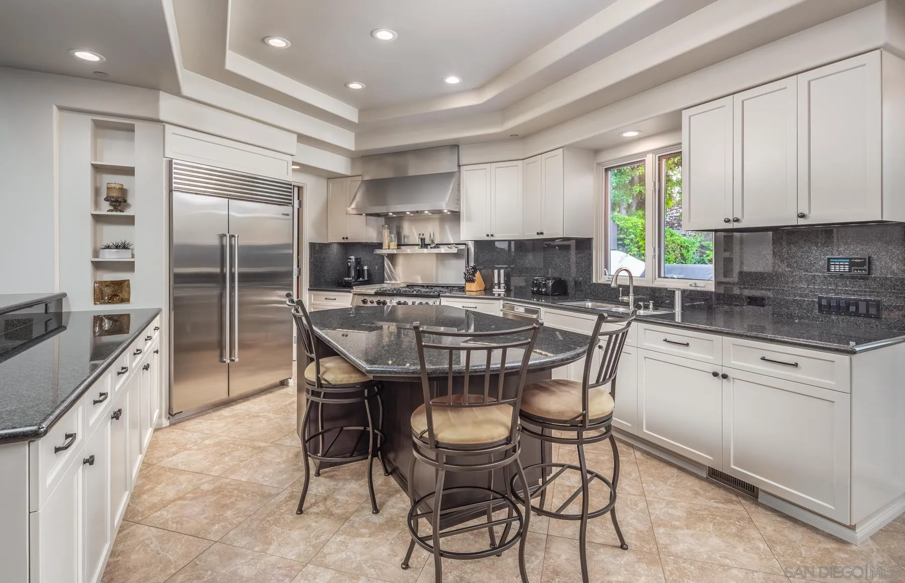 1375 Este Vista Court Encinitas, CA 92024 - Photo 8 of 31 a kitchen with a table chairs sink and cabinets