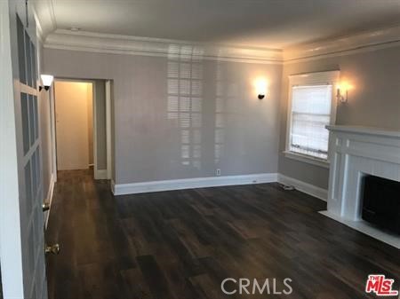 1025 Locust Avenue Long Beach, CA 90813 - Photo 25 of 64 a view of empty room with wooden floor and fireplace