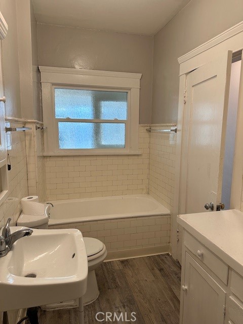 1025 Locust Avenue Long Beach, CA 90813 - Photo 41 of 64 a bathroom with a sink a toilet and shower
