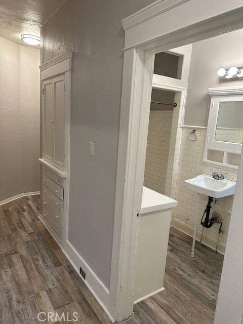 1025 Locust Avenue Long Beach, CA 90813 - Photo 42 of 64 a bathroom with a sink a toilet and shower