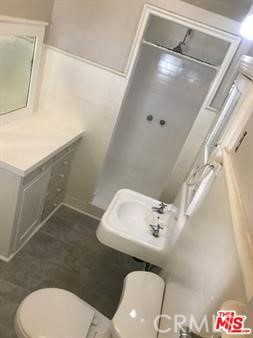 1025 Locust Avenue Long Beach, CA 90813 - Photo 44 of 64 a bathroom with a sink and a mirror