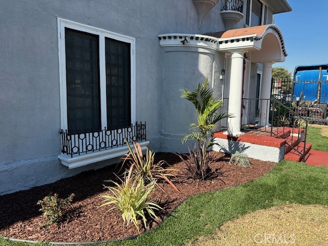 1025 Locust Avenue Long Beach, CA 90813 - Photo 5 of 64 a view of a balcony with chairs and potted plants