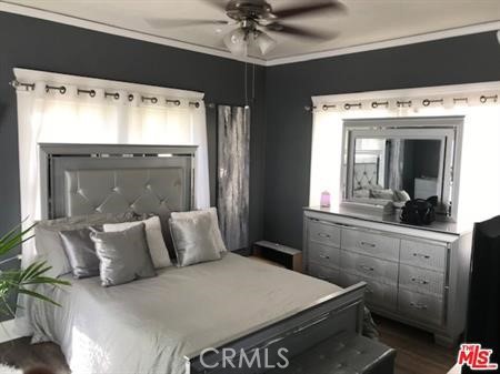 1025 Locust Avenue Long Beach, CA 90813 - Photo 8 of 64 a bed room with a bed and a television