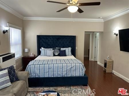 1025 Locust Avenue Long Beach, CA 90813 - Photo 10 of 64 a bedroom with a bed a flat screen tv and a chandelier
