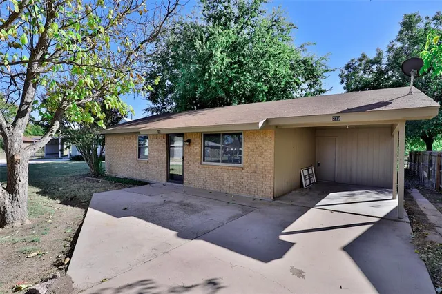 a view of a backyard with a patio